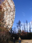 A picture taken to show how big the satellite is compared to a human.