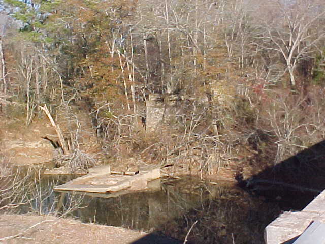 Pier in water and piers in woods from new bridge