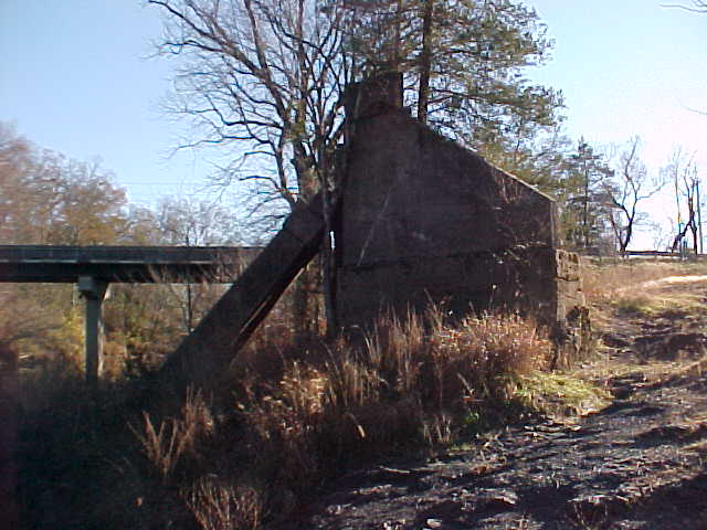 West abutment with collapsed pier leaning against it
