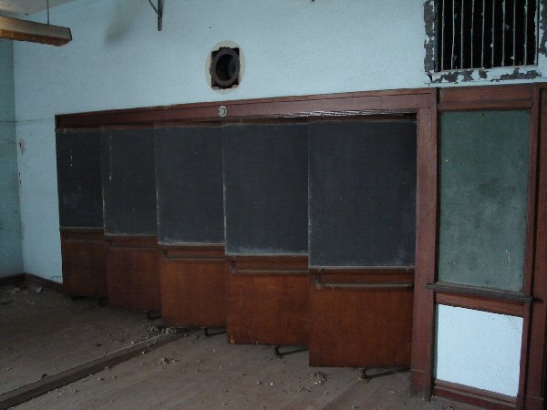 Every classroom had a set of these pivoting closet doors. They all opened and closed together.