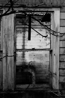 A broken window on one of the old buildings there.