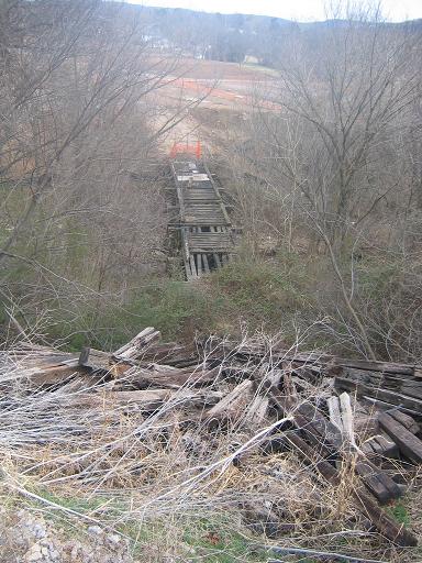 This bridge would connect to the road that went through the filled in tunnel. There is a precarious pile of rail road ties there too, which I wasn't brave enough to climb over.